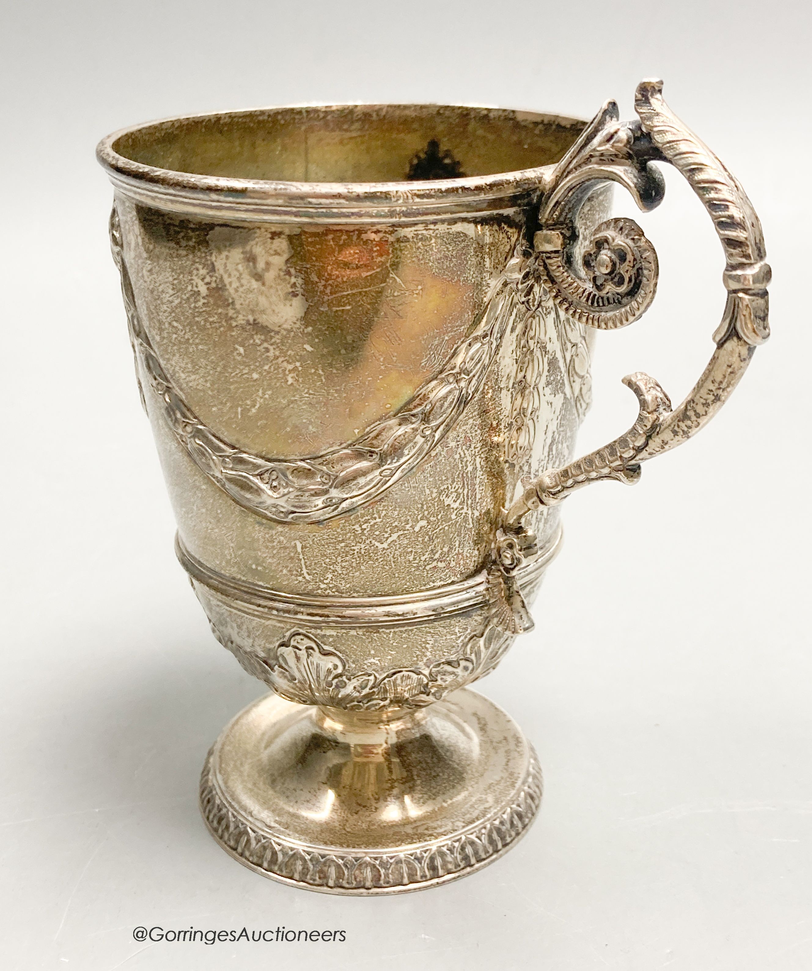 A Victorian silver pedestal christening mug, Jackson & Chase, London, 1877, 11.1cm, 4oz.